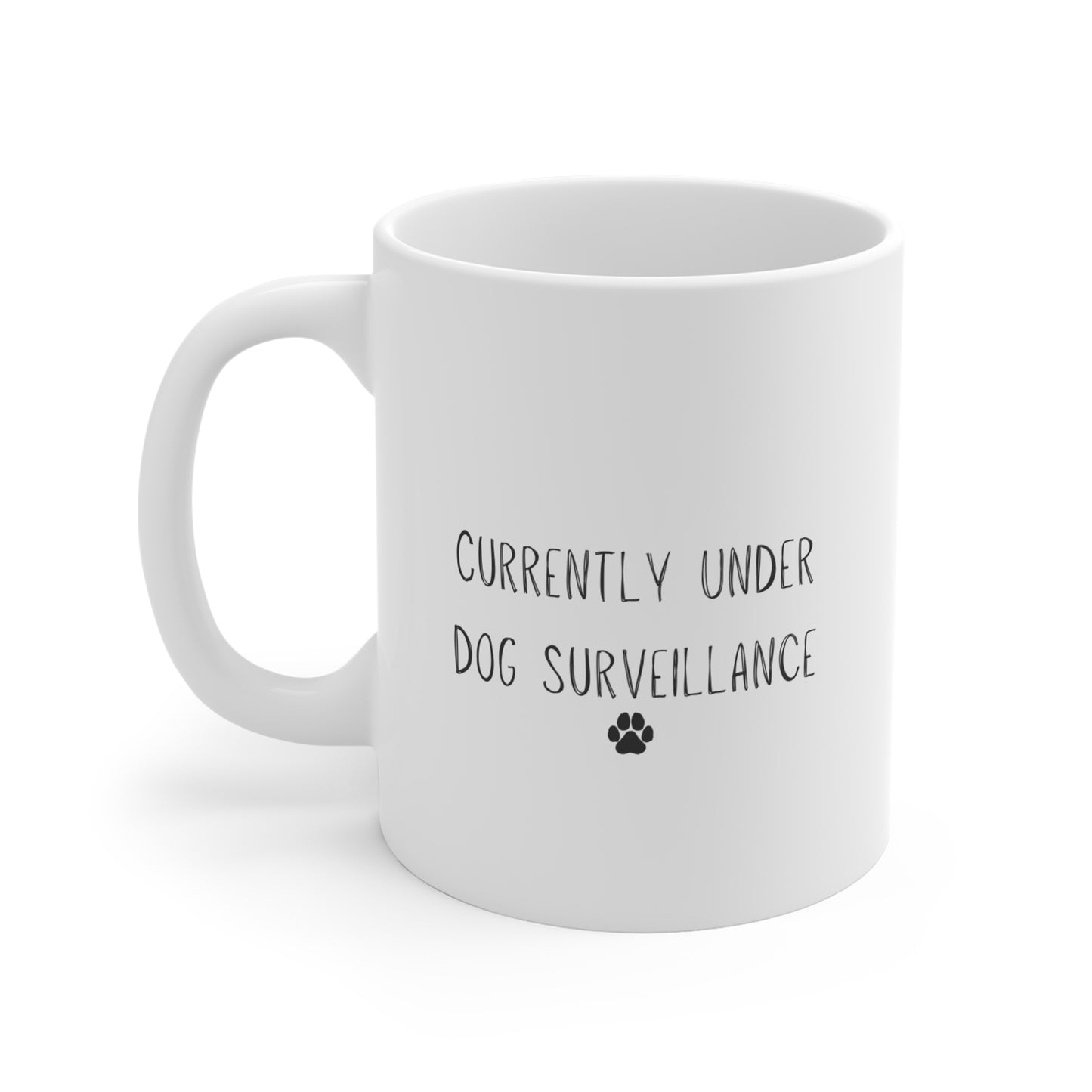 11oz white mug with “Currently Under Dog Surveillance” quote design by Rudy & Co.
